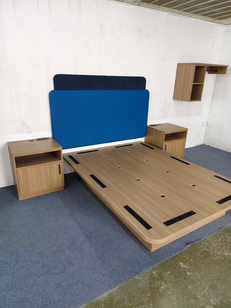 Hotel bed frame and nightstands at intermediate production stage — WUMEI production follow-up