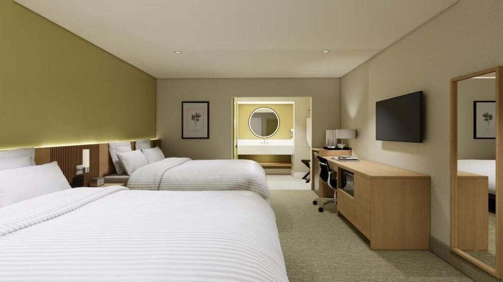 Design rendering of Double Queen guestroom — 53-room hotel renovation, WUMEI