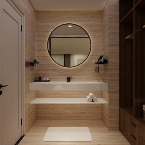 Modern luxury bathroom with large-format beige travertine-look tiles, floating white vanity, round LED mirror, and matte black fixtures